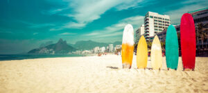 Bright surfboards stick in the sand on Ipanema Beach.
