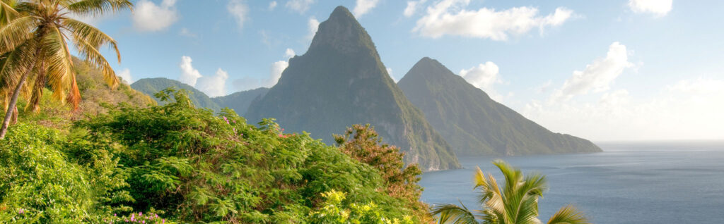 In the distance, the Pitons rise sharply from the shoreline on St. Lucia.