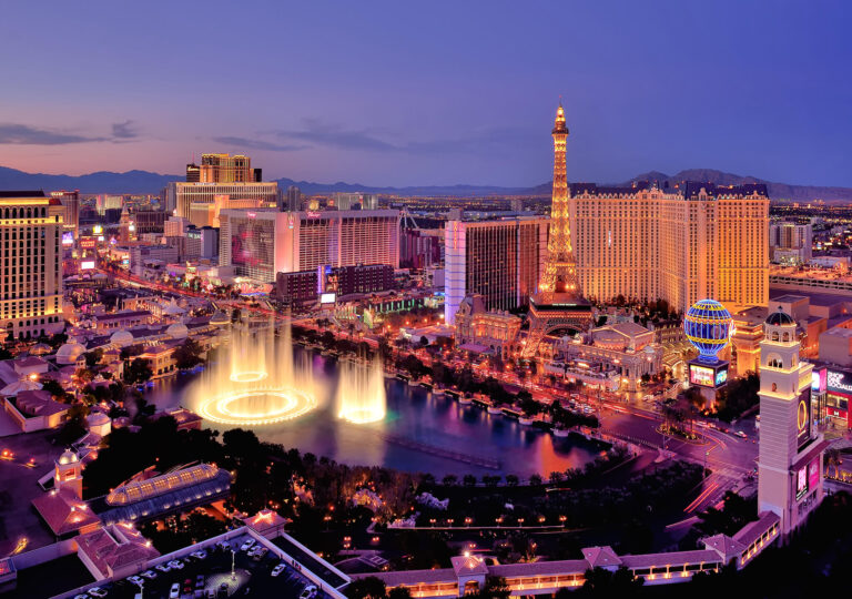 The lights of Las Vegas twinkle in Nevada's twilight.