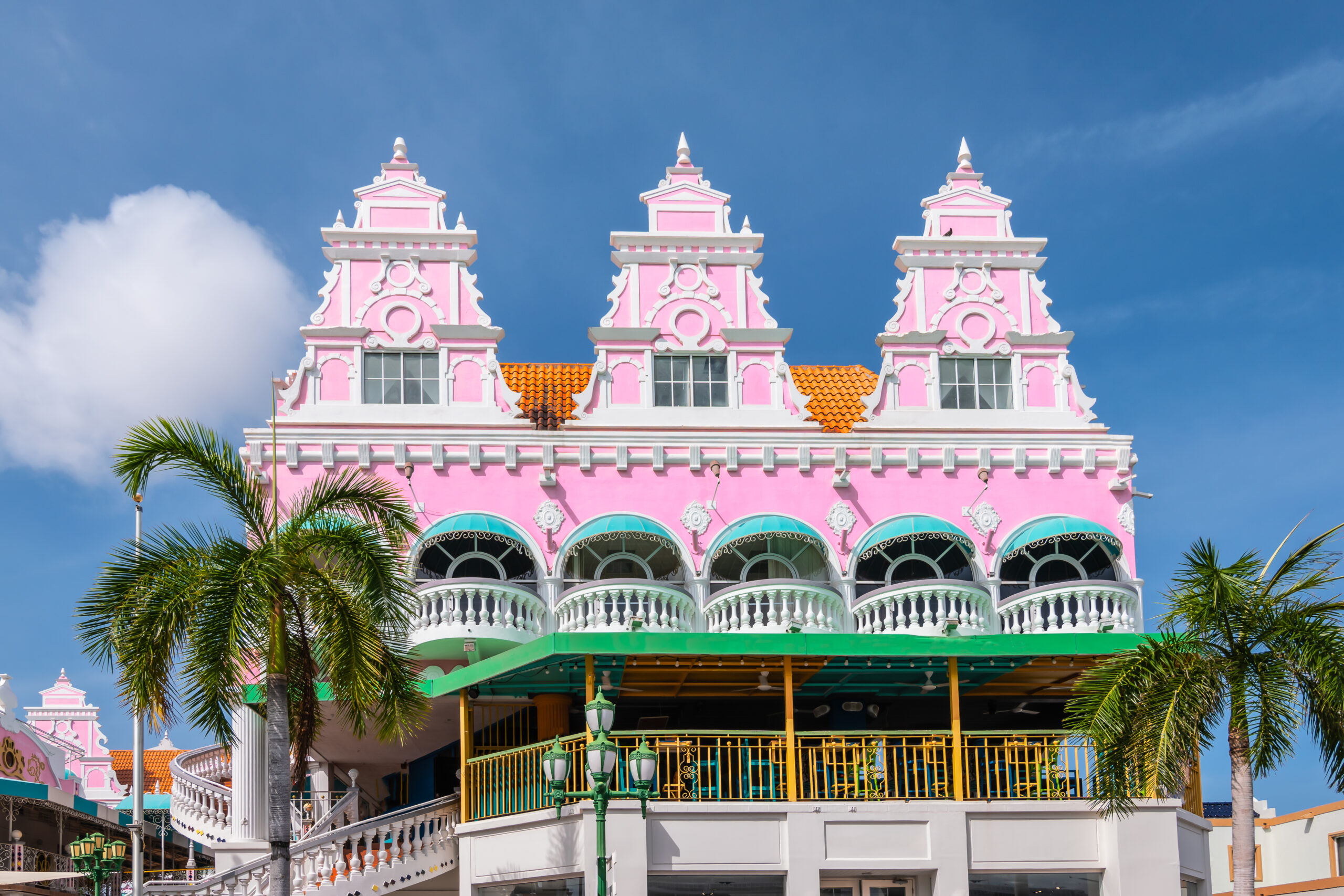 Beautiful pink colored facade of Dutch colonial architecture in city center of Oranjestad, Aruba.